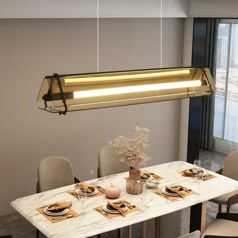 Modern gold-toned rectangular pendant lamp with transparent glass panels for dining room decorbites amber led lighting