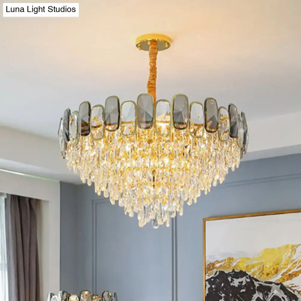 A luxurious gold-toned decorbites modern crystal cone chandelier with cascading clear crystal droplets and mirrored panels