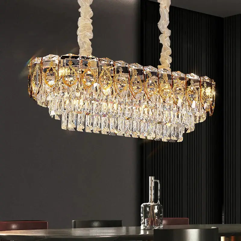 Modern gold and amber decorbites crystal chandelier with cascading clear crystal prisms and twisted white fabric chains