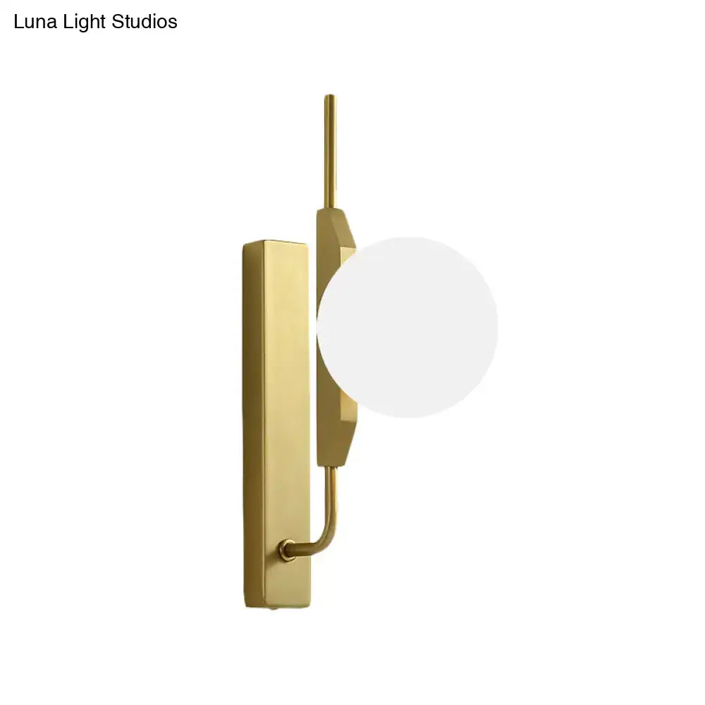 Modern gold and amber glass orb light fixture with frosted globe shade and rectangular backplate for 110v-120v use