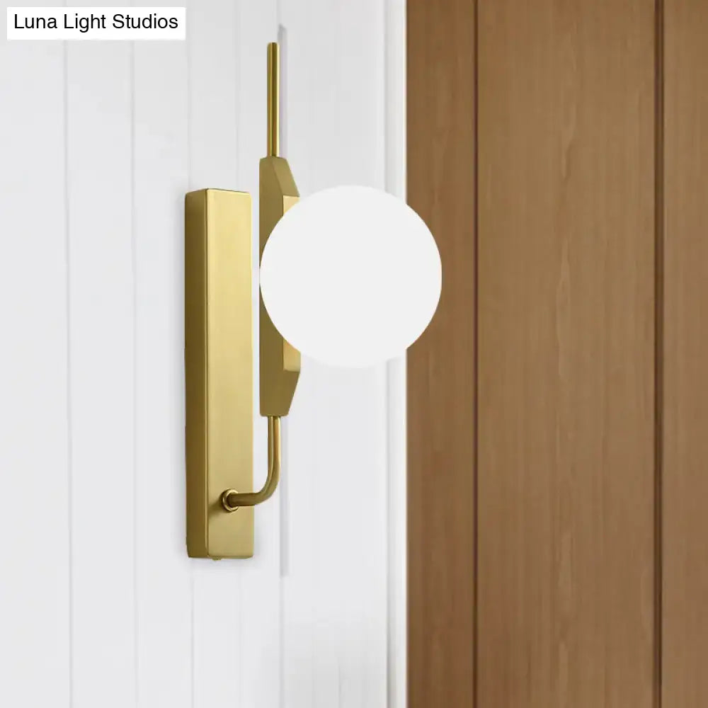 Modern gold and amber glass orb light fixture with frosted glass shade and rectangular backplate for 110v-120v use