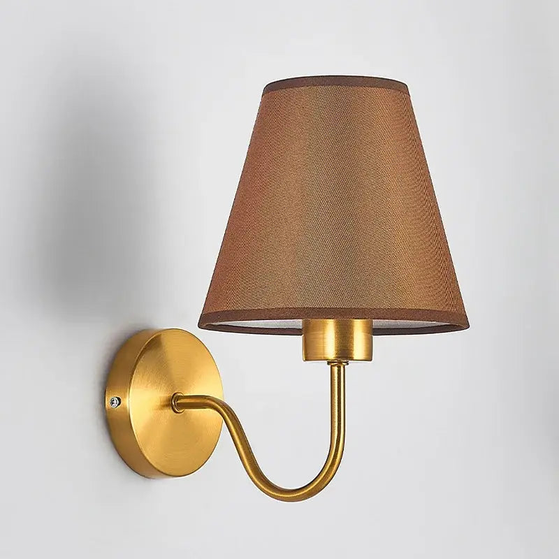 Modern gold and beige cloth led wall lamp with gold-toned sconce and textured brown fabric shade for bedroom decorbites cloth led