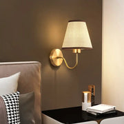 Modern gold and beige cloth led wall lamp with textured fabric shade for bedroom decorbites cloth led wall use