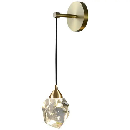 Modern gold and black decorbites crystal wall sconce with brass base and faceted crystal pendant for bedroom lighting