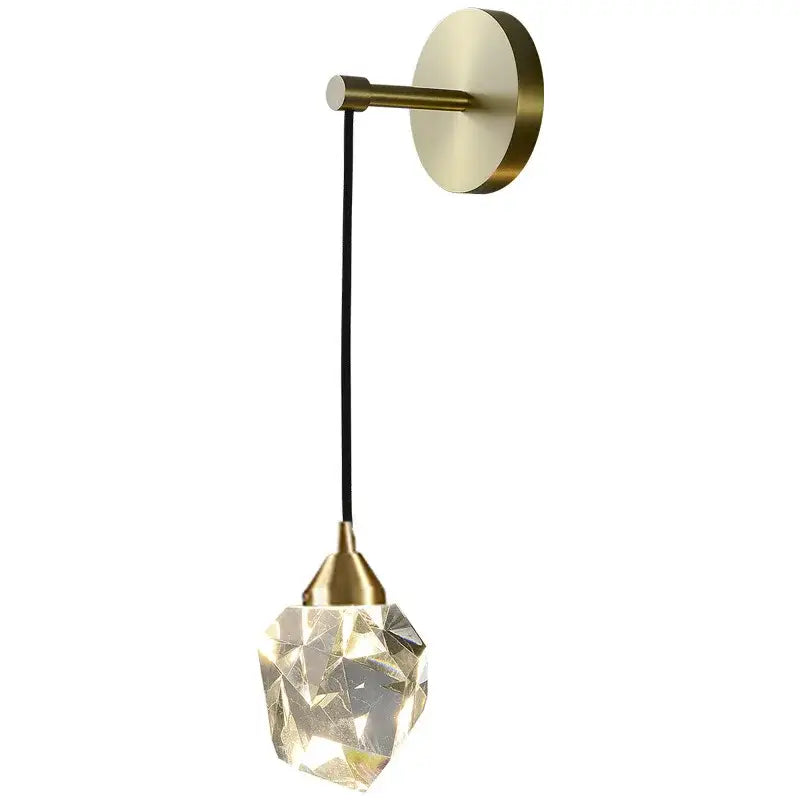 Modern gold and black decorbites crystal wall sconce with brass base and faceted crystal pendant for bedroom lighting