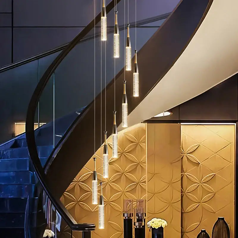 Modern gold and black decorbites crystal chandelier with sleek cylindrical glass pendant lights for living room illumination