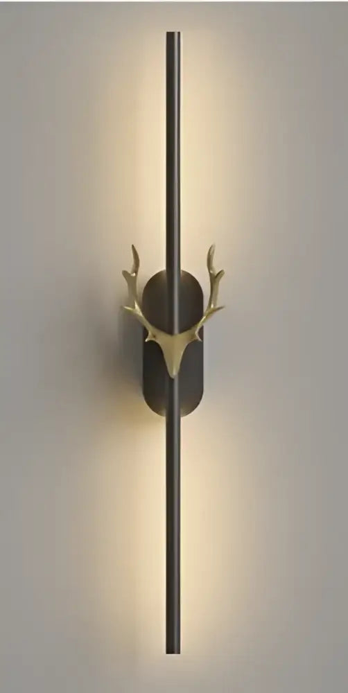 Modern gold and black deer horn led wall lamp with a sleek vertical bar and elegant decorbites deer horn accent