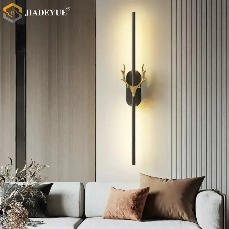 Modern gold and black deer horn led wall lamp featuring a gold-toned antler design with a sleek black metal rod decorbites deer horn