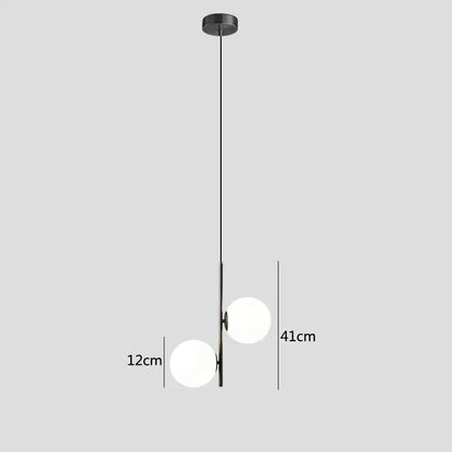 Modern black metal pendant light with two frosted glass spheres featuring glass ball led design for bedroom use