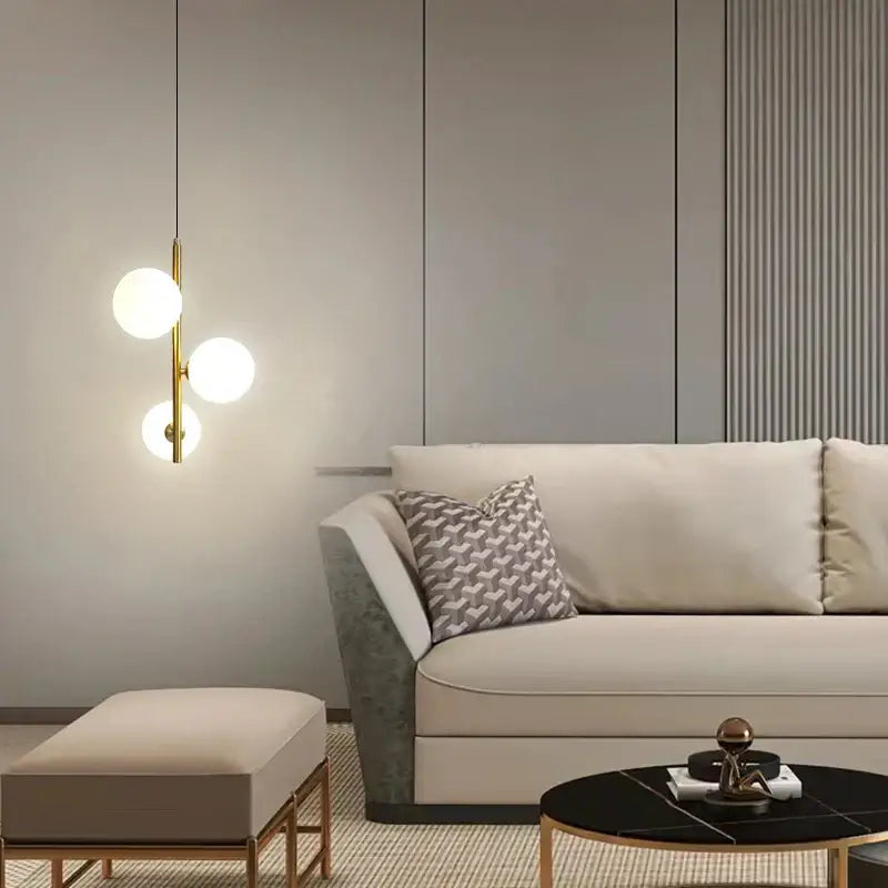 Modern gold and black pendant light with three gold-toned glass ball led bulbs for bedroom hanging lamp lighting