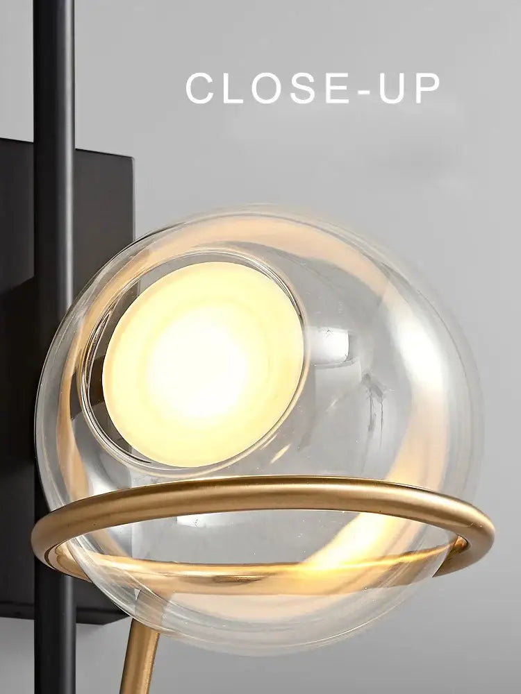 Modern gold and black decorbites glass ball pendant light with spherical glass and metal ring for living room decor