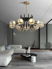 Modern gold and black glass ball pendant light with multiple spherical shades and black arms for living room decorbites