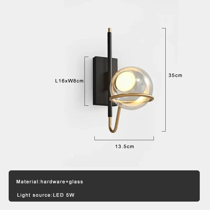 Modern gold and black glass ball pendant light with sleek black hardware and clear glass globe for living room decorbites pendant light
