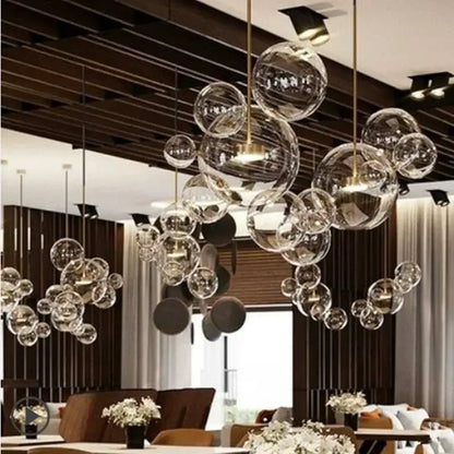 Modern gold and black glass chandelier with clear bubble glass and gold-toned metal by decorbites glass chandelier
