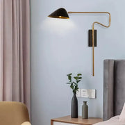 Modern gold and black led wall lamp with adjustable rocker arm and black conical shade for bedroom lighting