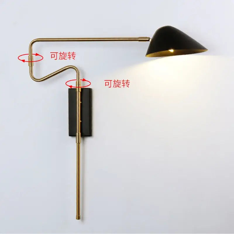 Black conical led wall lamp with gold interior and brass adjustable rocker arm for modern bedroom lighting