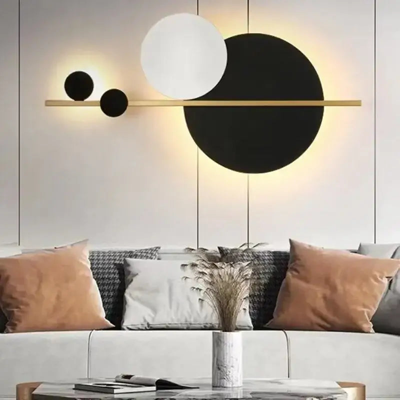Modern gold and black led wall lamp with geometric design and three circular shades for bedroom sconce lighting