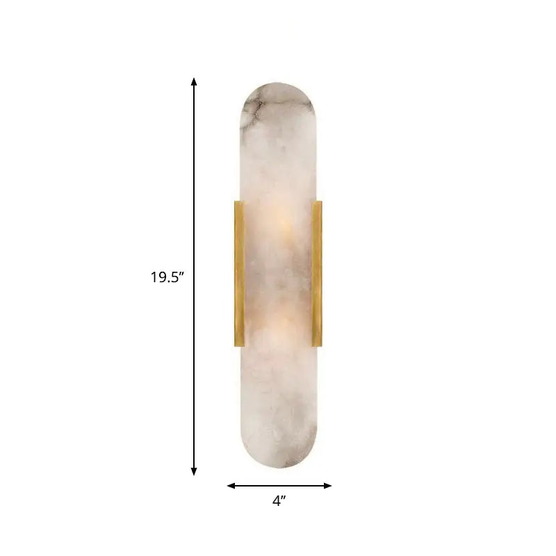 A sleek, 19.5-inch tall wall sconce featuring a translucent white marble-like diffuser with subtle gray veining and two vertical brass bars for support.