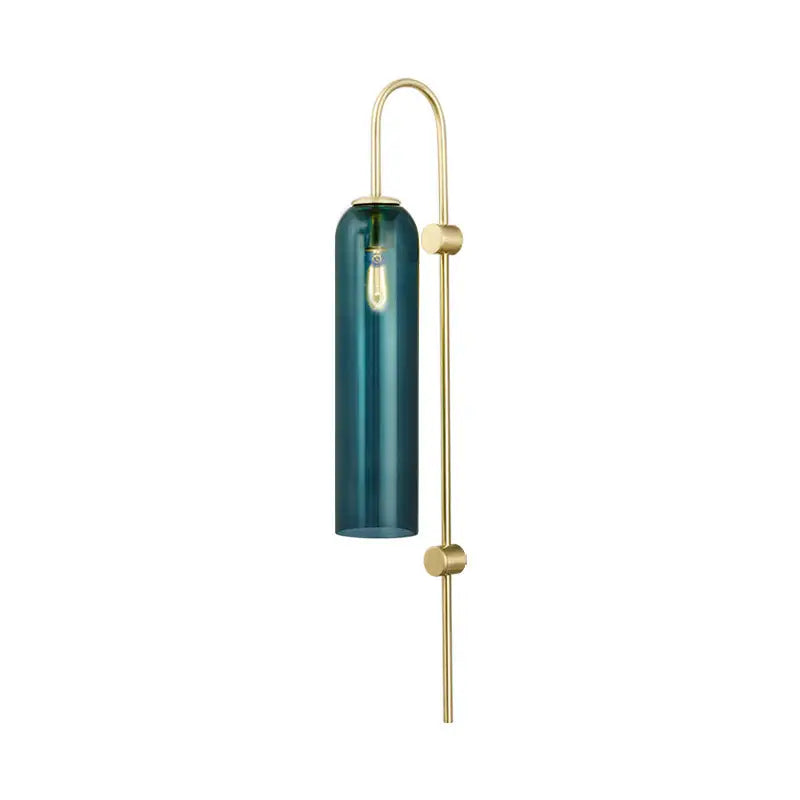 A modern gold and black orb wall lamp with a sleek teal glass cylinder and exposed filament bulb for living rooms
