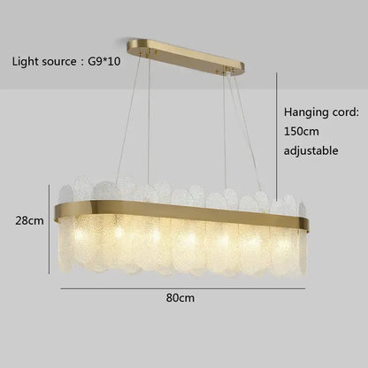 Modern gold and blue glass chandelier with textured leaf-like shades in a sleek frame for enhanced dining experience lighting solution