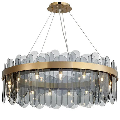 Modern gold and blue glass chandelier with translucent gray leaf-shaped shades provides elegant dining experience lighting solution
