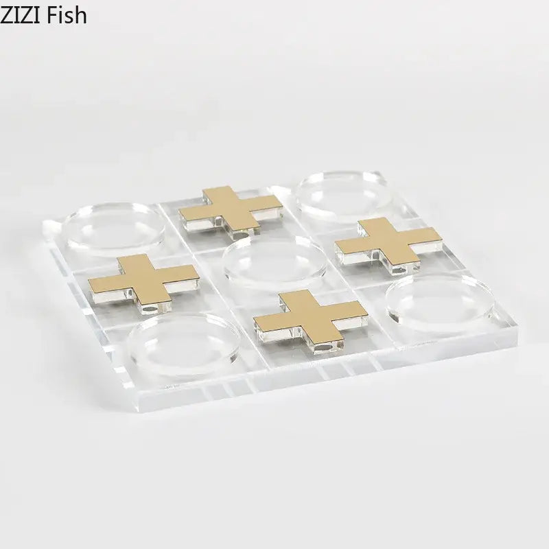Modern gold and clear acrylic tic-tac-toe chessboard set with gold cross markers for living room decor