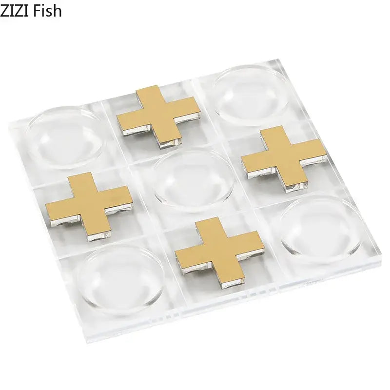 Modern gold and clear acrylic tic-tac-toe chessboard set featuring gold cross markers for stylish living room decor