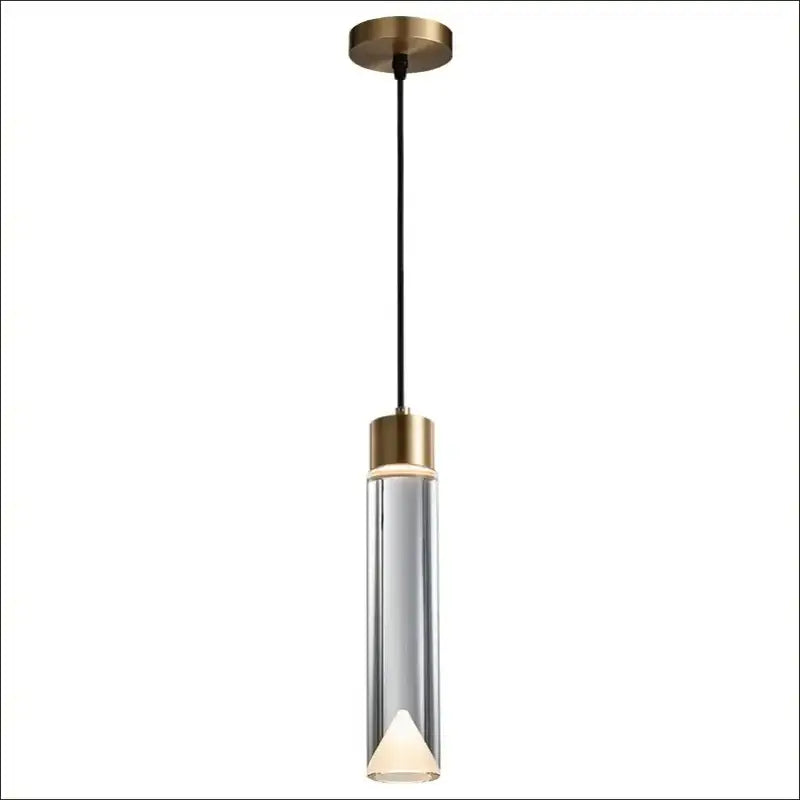 Modern gold and clear crystal copper pendant light with brass-finished top, clear glass body, and illuminated triangular bulb