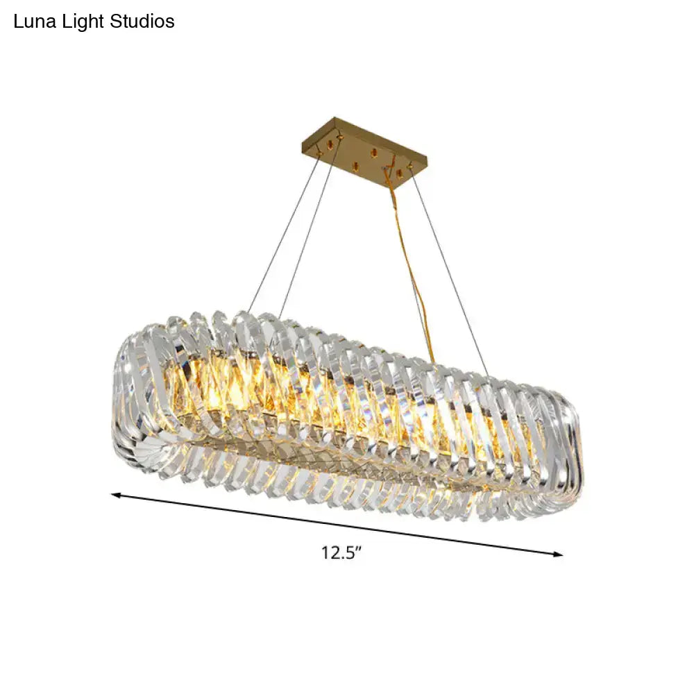 Elegant modern gold pendant light with clear crystal faceted segments designed for dining room illumination