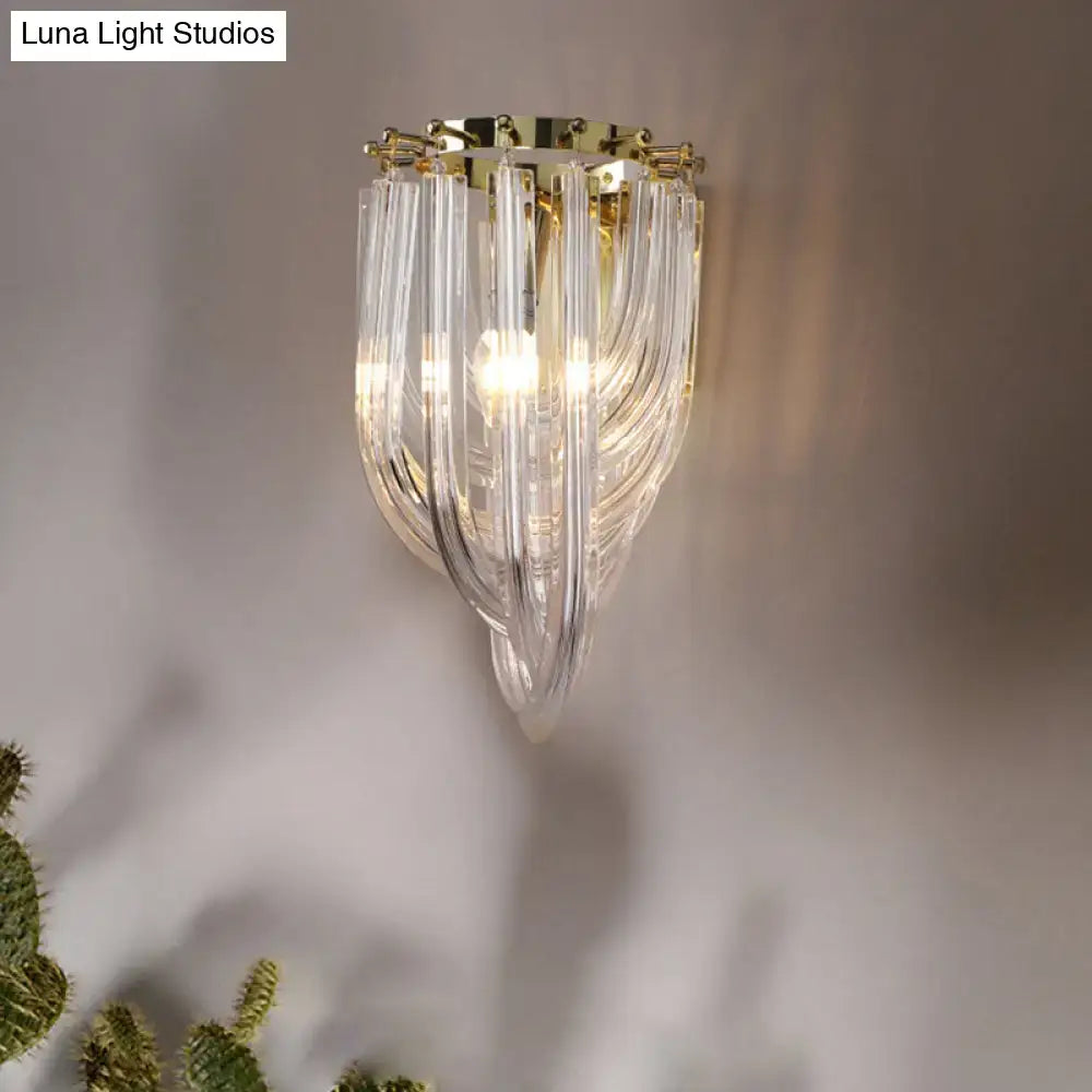 Clear glass chandelier with gold-toned metal frame featuring clear glass geometric design for living room lighting