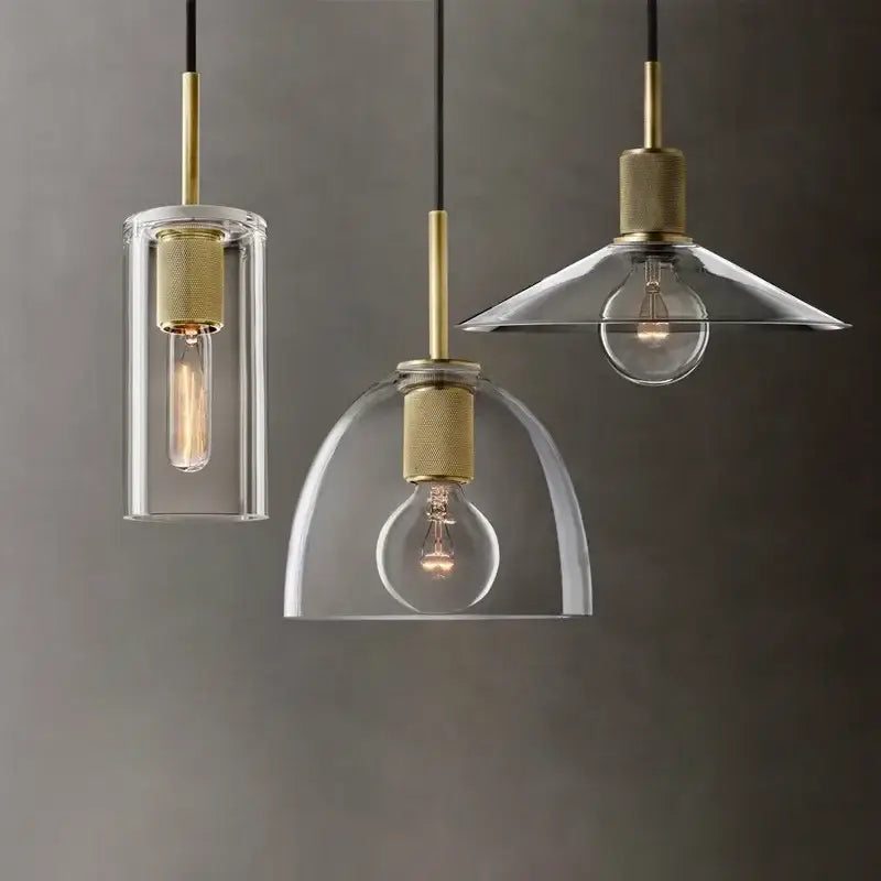 Modern gold and clear glass led pendant light trio with exposed filament bulbs for dining room lighting