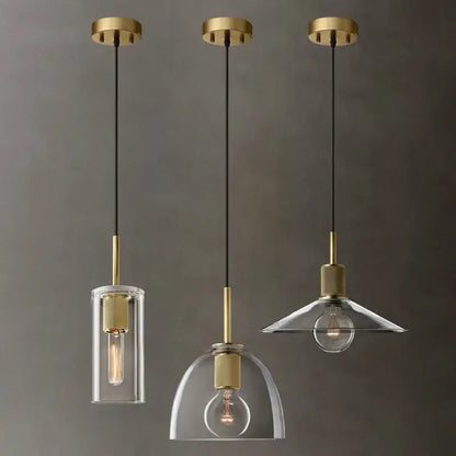 Modern gold and clear glass led pendant light trio with brass fixtures and exposed filament bulbs for dining room use