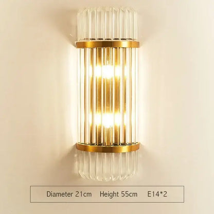 Modern gold and clear glass led wall lamps featuring vertical crystal rods and a warm glow for bedroom use