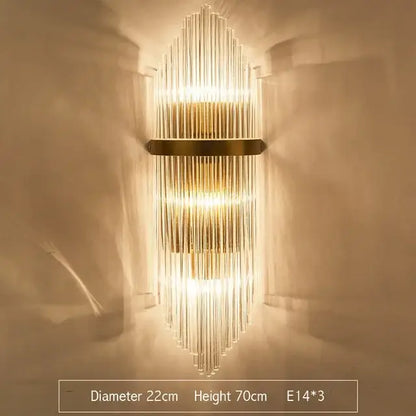 Modern gold and clear glass led wall lamps featuring vertical glass rods and a sleek metallic frame for bedroom use