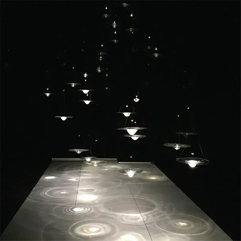 A modern gold and clear glass pendant light with multiple tiers of translucent discs for bedroom decorbites clear glass decor