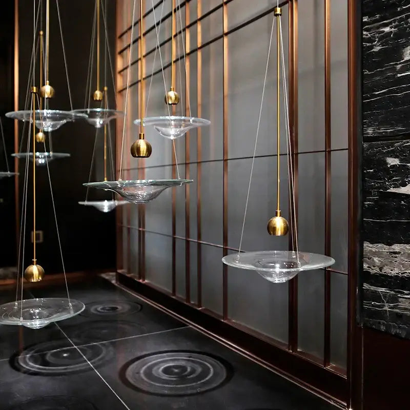 Modern gold and clear glass pendant lights with bowl-shaped shades and metal fixtures for bedroom decorbites clear glass design