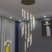 Modern gold and crystal cylindrical stair chandelier with a circular ceiling mount for decorbites cylindrical stair decor