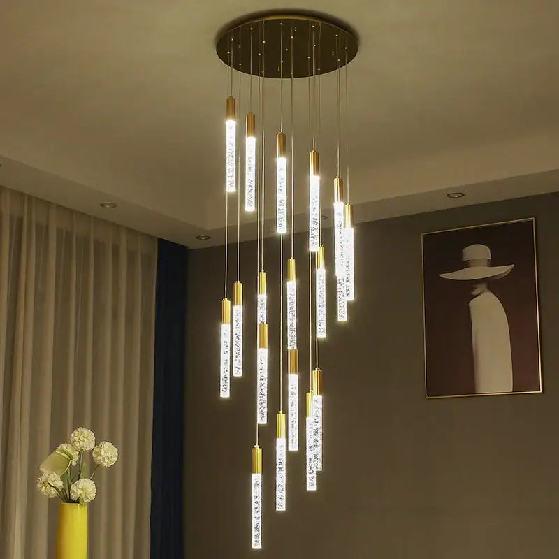 Modern gold and crystal cylindrical stair chandelier with cascading crystal-encrusted lights by decorbites cylindrical stair