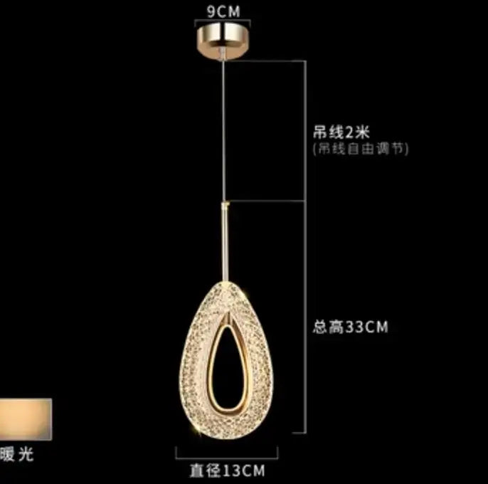 Modern gold and crystal oval bedside pendant light with gold-toned teardrop design and adjustable 2-meter chain