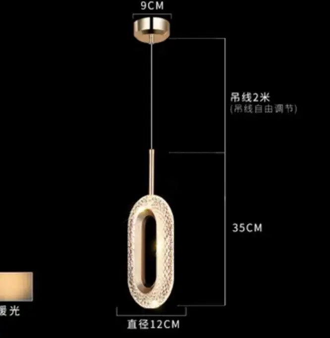 Modern gold and crystal oval bedside pendant light with textured surface and adjustable 2 meter hanging chain