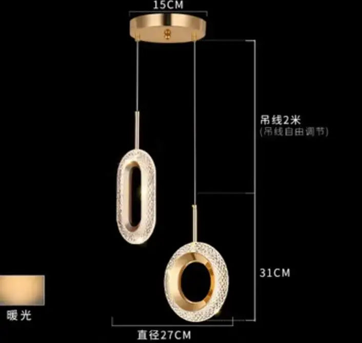 Modern gold and crystal oval bedside pendant light with gold-toned crystal-encrusted shades and adjustable chain