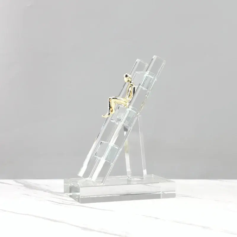 Modern gold and crystal staircase statue featuring a golden figurine on a decorbites crystal staircase base for living room decor