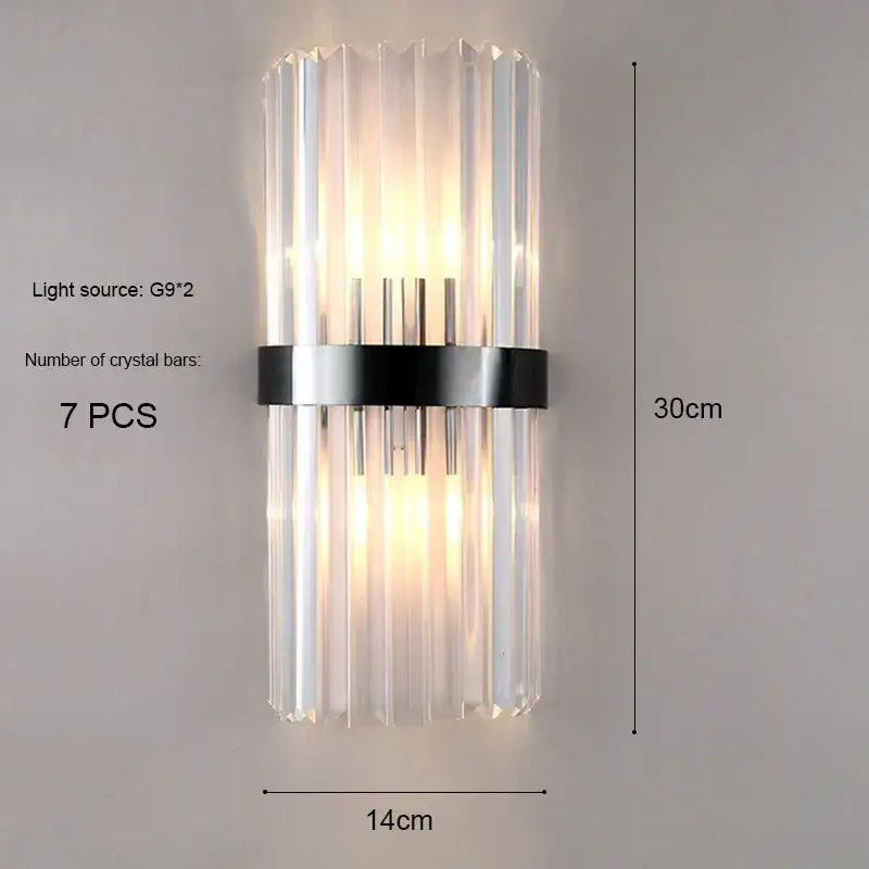 Modern gold and crystal wall light featuring seven clear crystal bars secured by a sleek black metal band for decorbites crystal wall decor