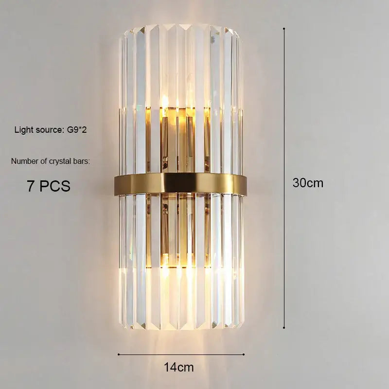 Modern gold and crystal wall light featuring vertical crystal bars and a central brass band for elegant decorbites crystal wall decor