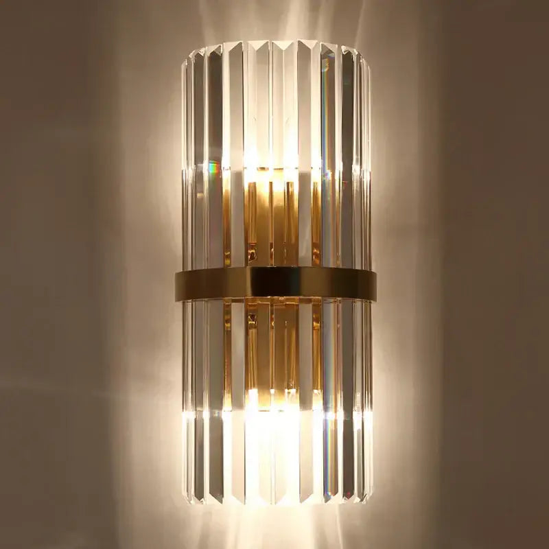 Modern gold and crystal wall light with vertical crystal prisms and metal band for elegant living room decorbites crystal wall