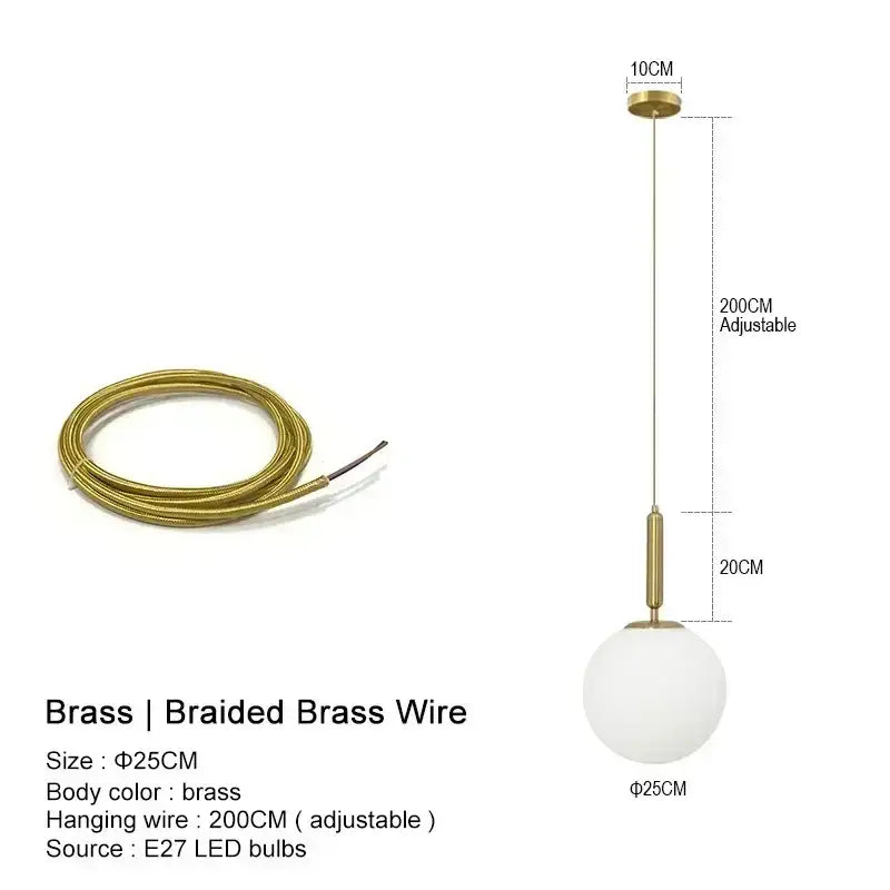 Modern gold and frosted glass globe pendant light with brass hardware ideal for kitchen island lighting