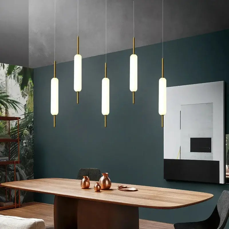 Five modern gold and frosted glass led pendant chandelier with cylindrical shades for living room lighting