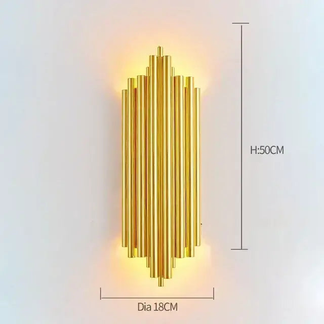 Modern gold and glass led wall lamps featuring golden metallic wall sconce with vertical cylindrical rods for bedroom use