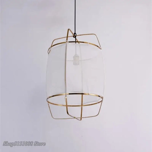 A modern gold and glass pendant light fixture with slender metal bars ideal for dining room decorbites bamboo linen