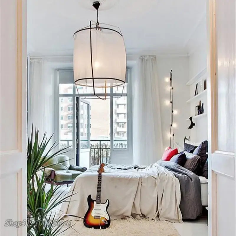 Modern gold and glass pendant light fixture with a sunburst finish electric guitar on the floor for decorbites bamboo linen decor